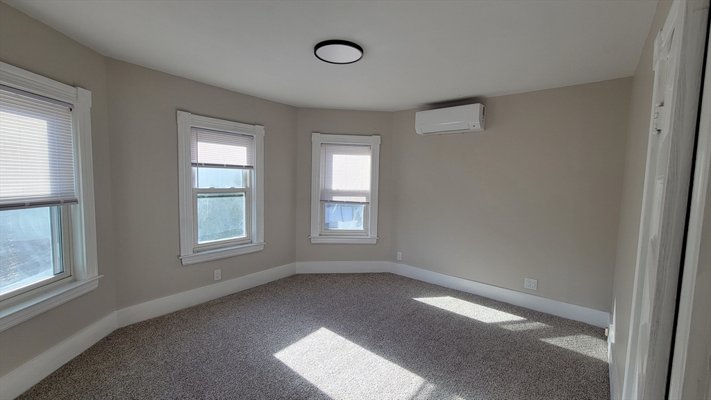 30 O'Neil Street, Unit 2 Hudson, MA 01749 - Photo 18 of 28 an empty room with a window