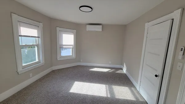 a view of staircase with white walls