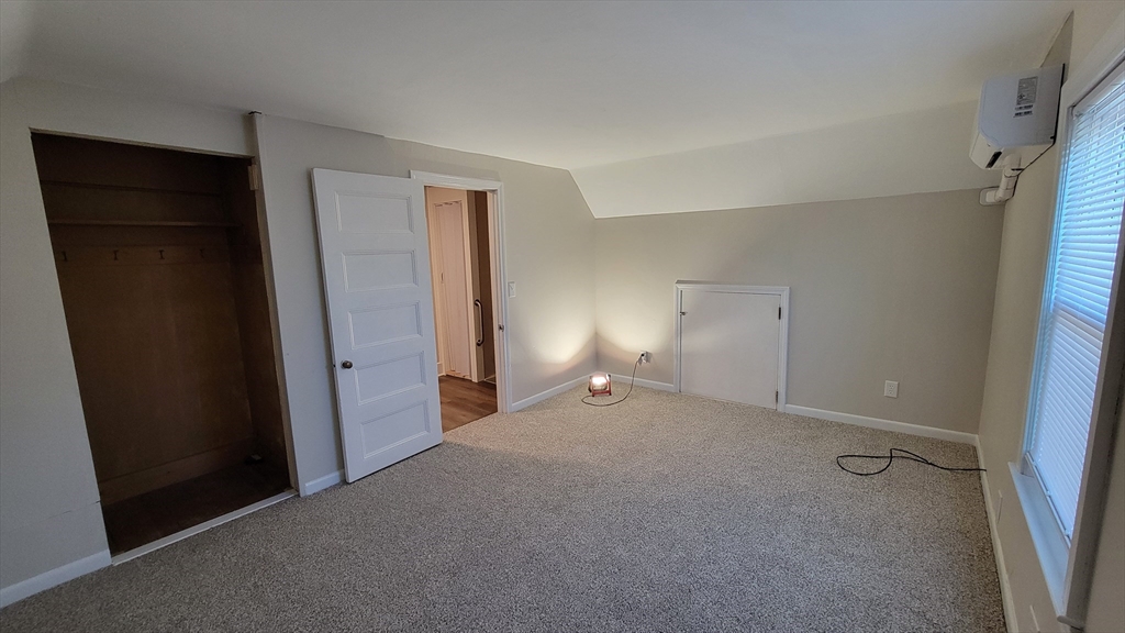 30 O'Neil Street, Unit 2 Hudson, MA 01749 - Photo 23 of 28 a view of an empty room with closet and a window