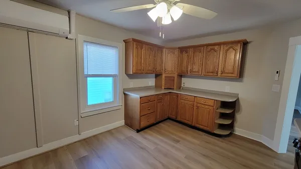 a kitchen with sink cabinets and window