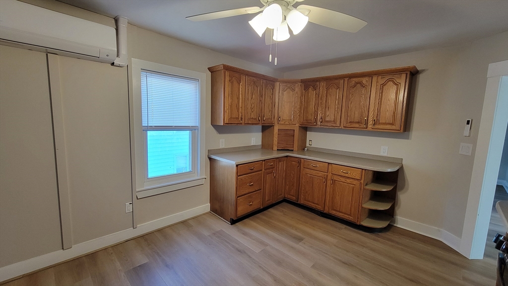 30 O'Neil Street, Unit 2 Hudson, MA 01749 - Photo 8 of 28 a kitchen with sink cabinets and window