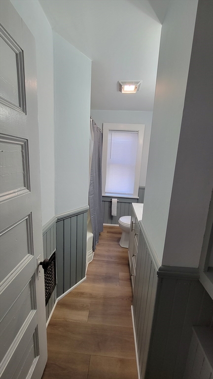 30 O'Neil Street, Unit 2 Hudson, MA 01749 - Photo 10 of 28 a view of a hallway with wooden floor and staircase