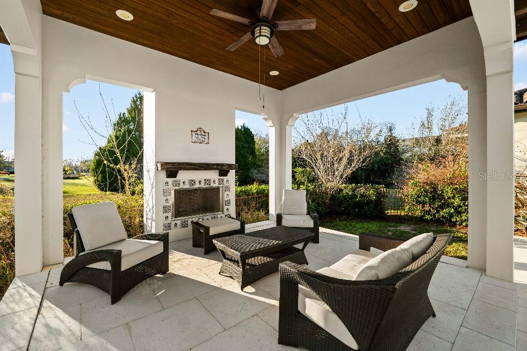 19002 Deer Point Place Odessa, FL 33556 - Photo 43 of 50 a outdoor space with patio couch and a fireplace