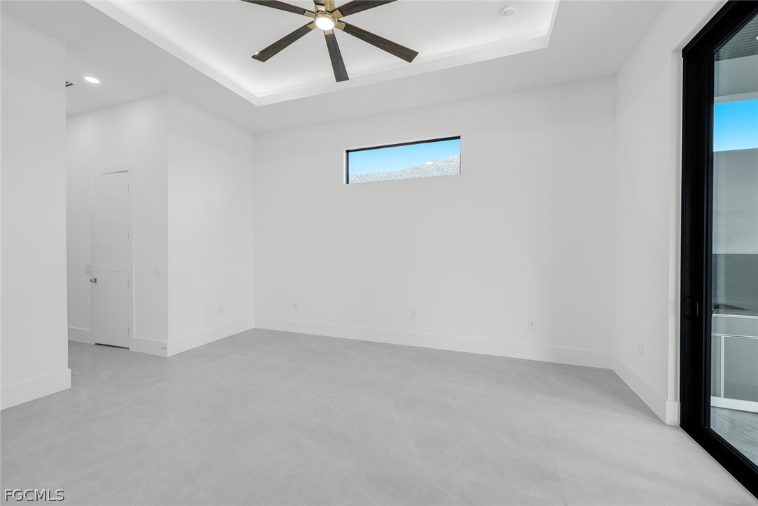 3606 Southwest 3rd Street Cape Coral, FL 33991 - Photo 25 of 47 an empty room with a window and a fan