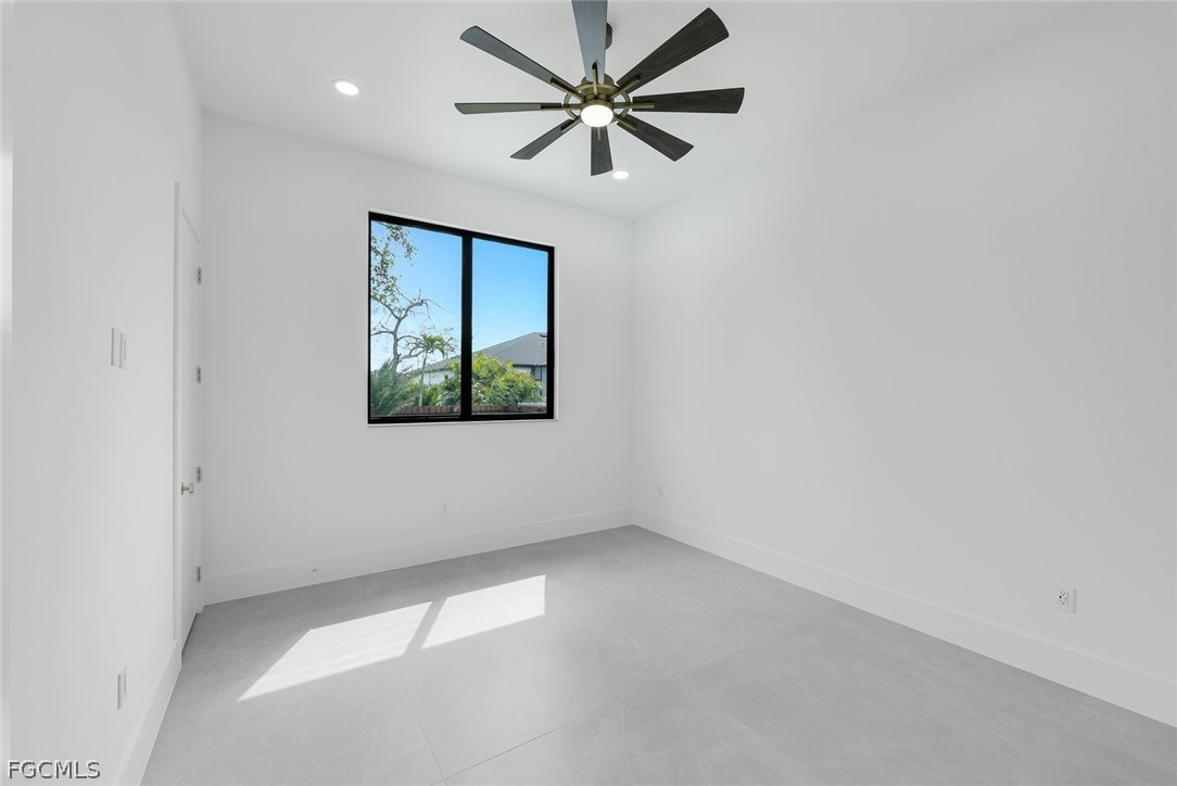 3606 Southwest 3rd Street Cape Coral, FL 33991 - Photo 31 of 47 an empty room with a window and a fan