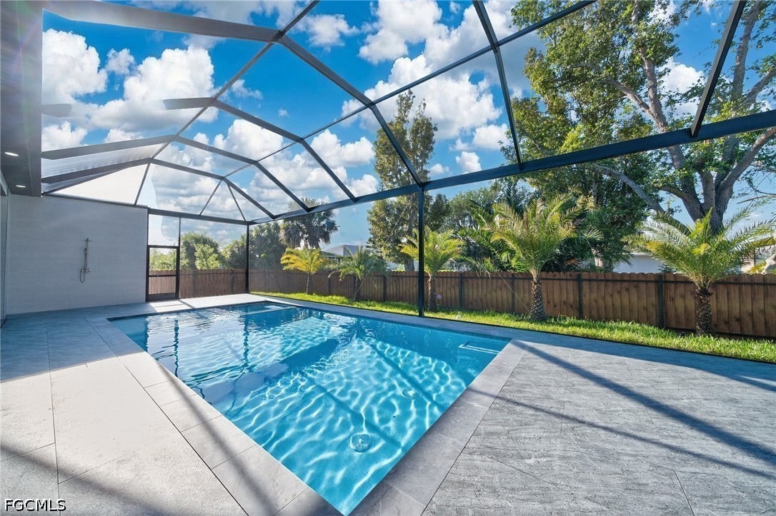 3606 Southwest 3rd Street Cape Coral, FL 33991 - Photo 42 of 47 a view of swimming pool with a yard