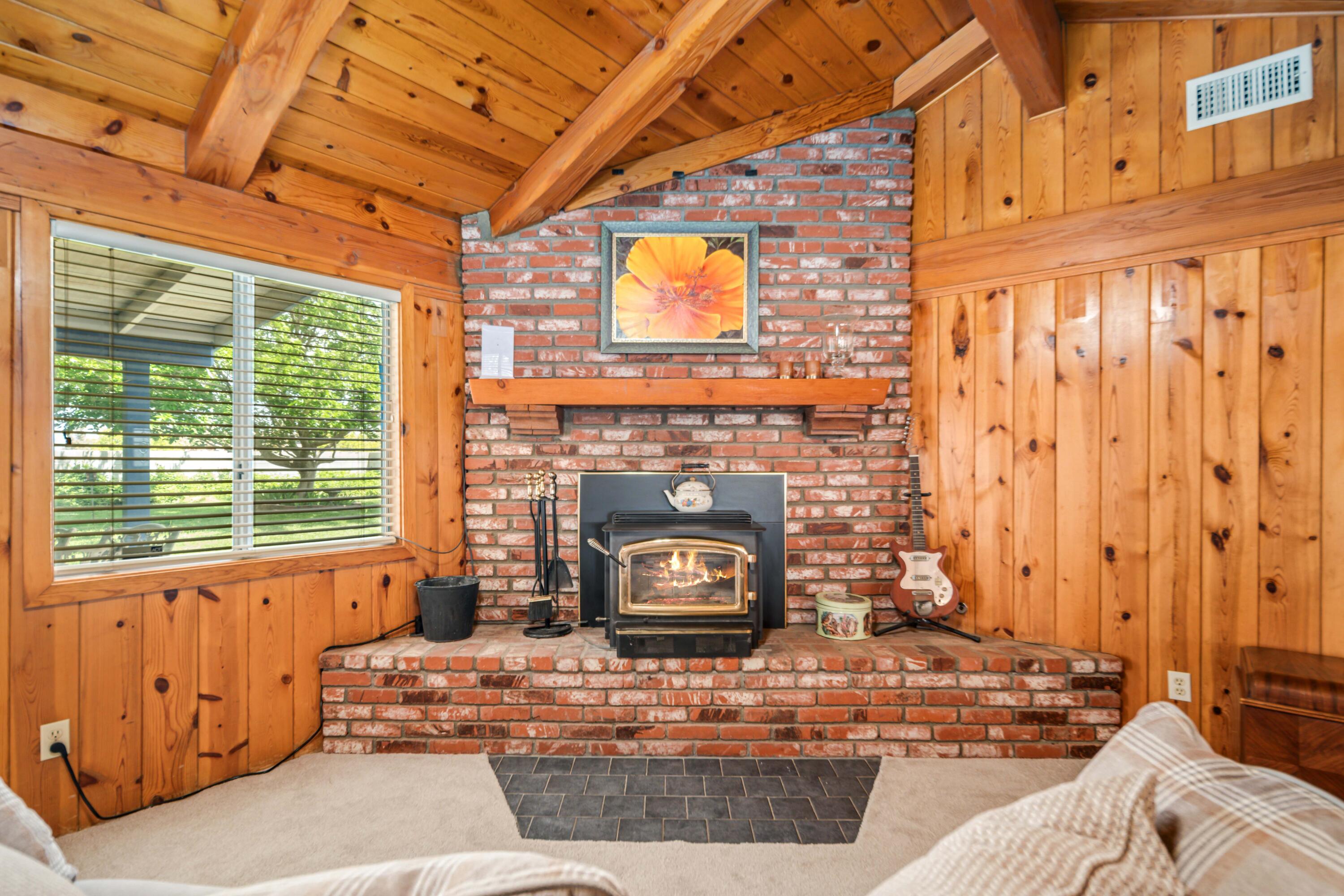 8141 Ave D-14 West Lancaster, CA 93536 - Photo 19 of 52 a living room with fireplace furniture and a window