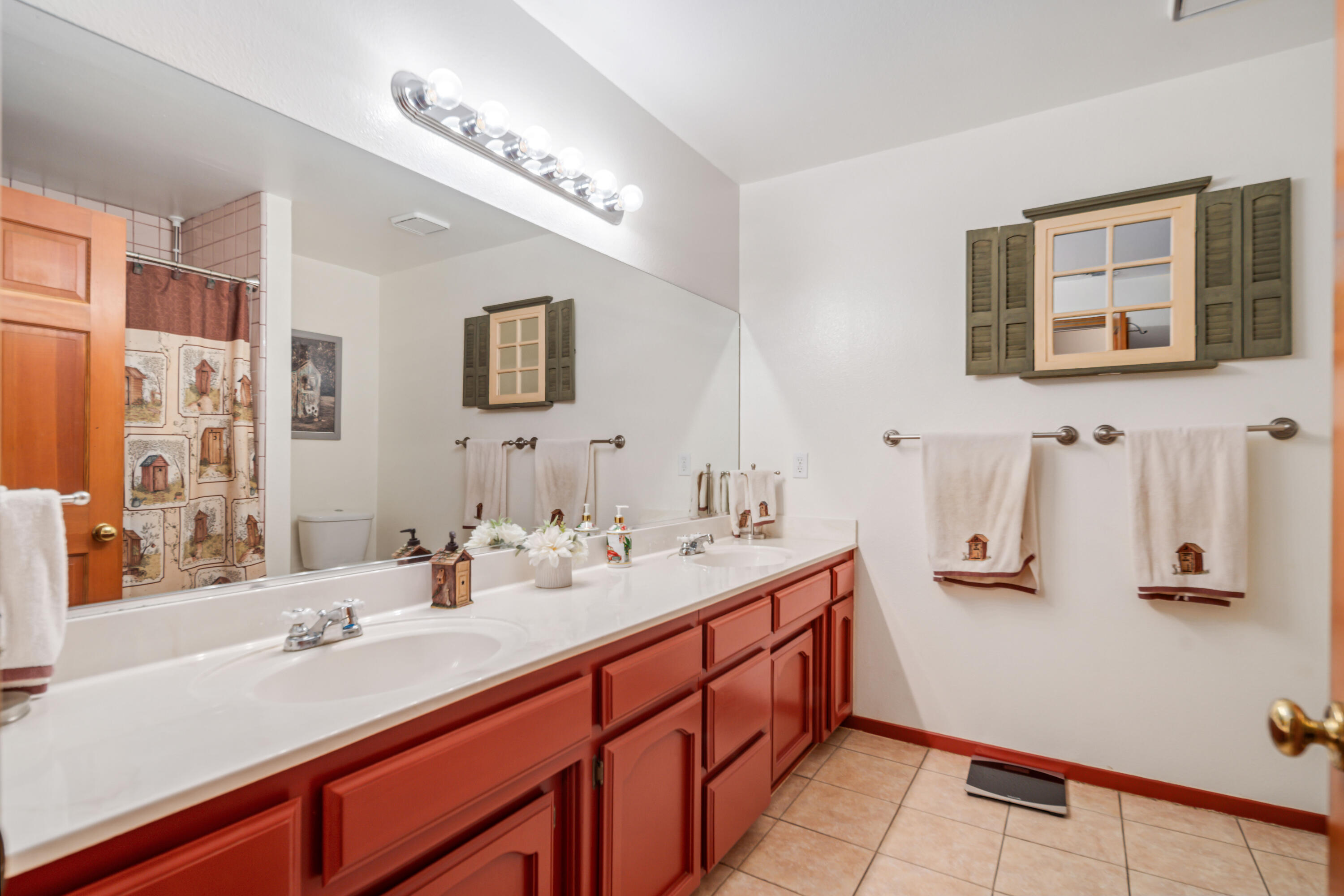 8141 Ave D-14 West Lancaster, CA 93536 - Photo 29 of 52 a bathroom with a sink and a mirror