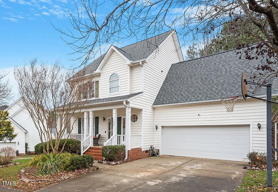7040 Bellard Court Raleigh, NC 27617 - Photo 1 of 31 a front view of a house with garden