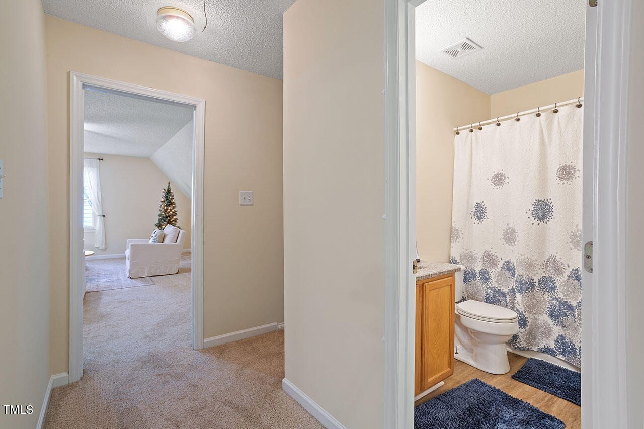 7040 Bellard Court Raleigh, NC 27617 - Photo 18 of 31 a bathroom with a sink a toilet and shower
