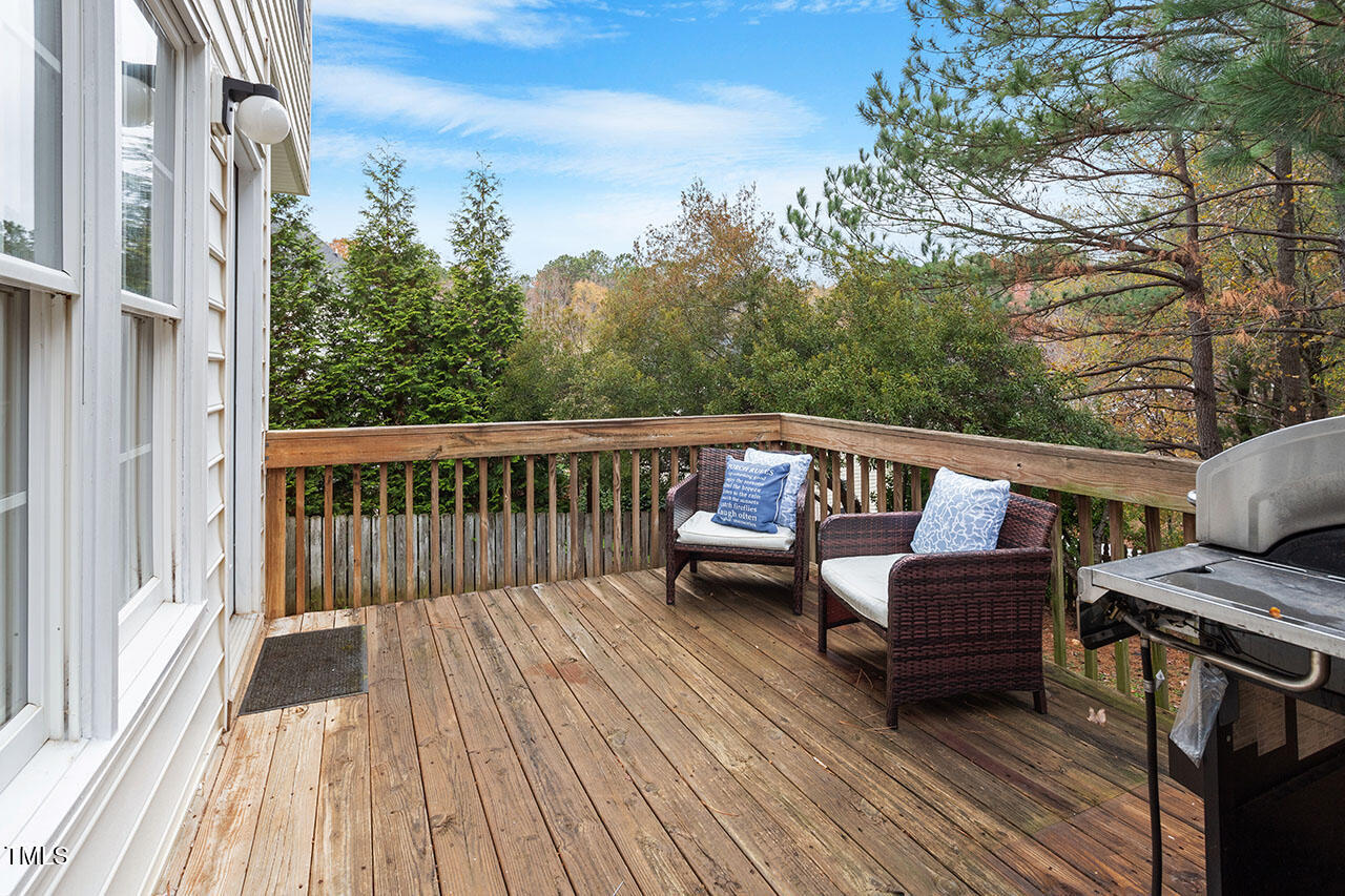 7040 Bellard Court Raleigh, NC 27617 - Photo 30 of 31 a view of a wooden deck with furniture