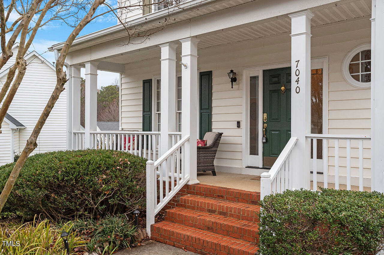 7040 Bellard Court Raleigh, NC 27617 - Photo 3 of 31 front view of a house with a yard