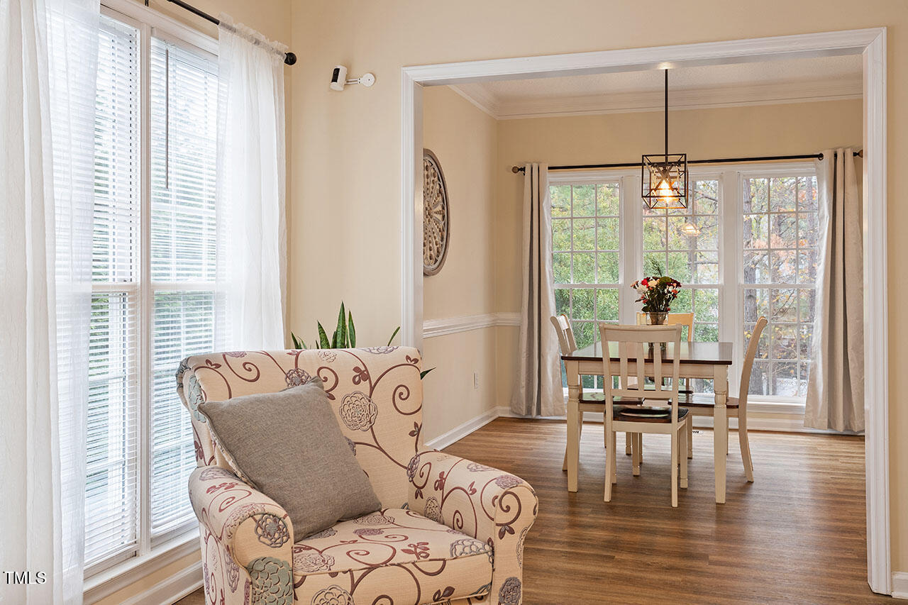 7040 Bellard Court Raleigh, NC 27617 - Photo 8 of 31 a living room with furniture and wooden floor
