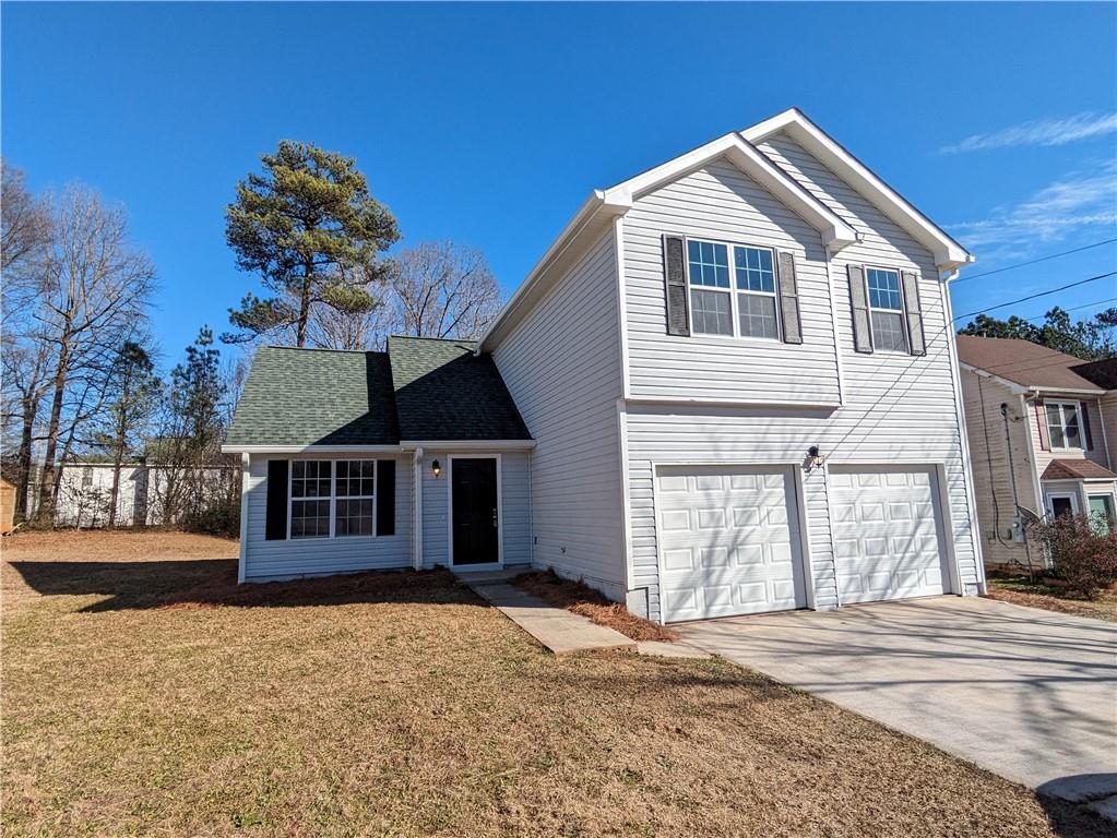 2526 Greenville Way Decatur, GA 30034 - Photo 1 of 1 a front view of a house with a yard and garage