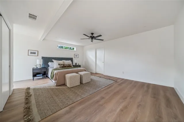 a bathroom with a shower a toilet and sink