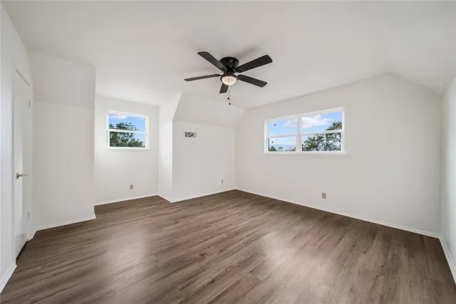 a view of a house with pool and chairs