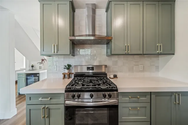 a kitchen with granite countertop a stove and a cabinets