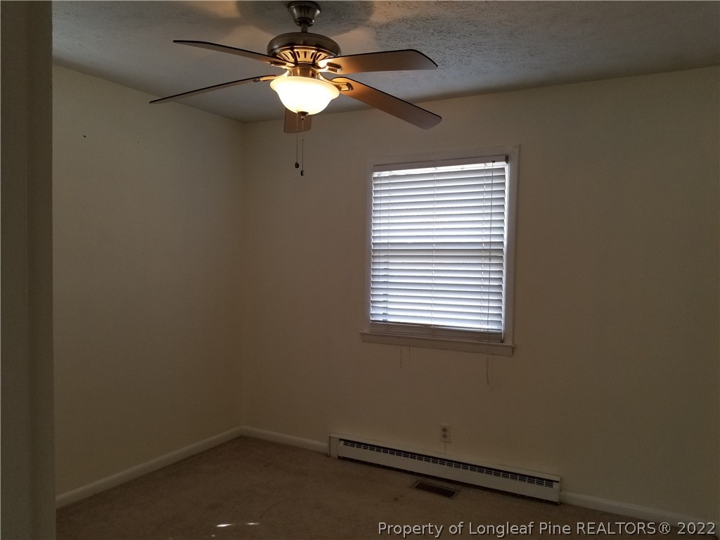 3227 Legion Road Hope Mills, NC 28348 - Photo 4 of 10 an empty room with a window
