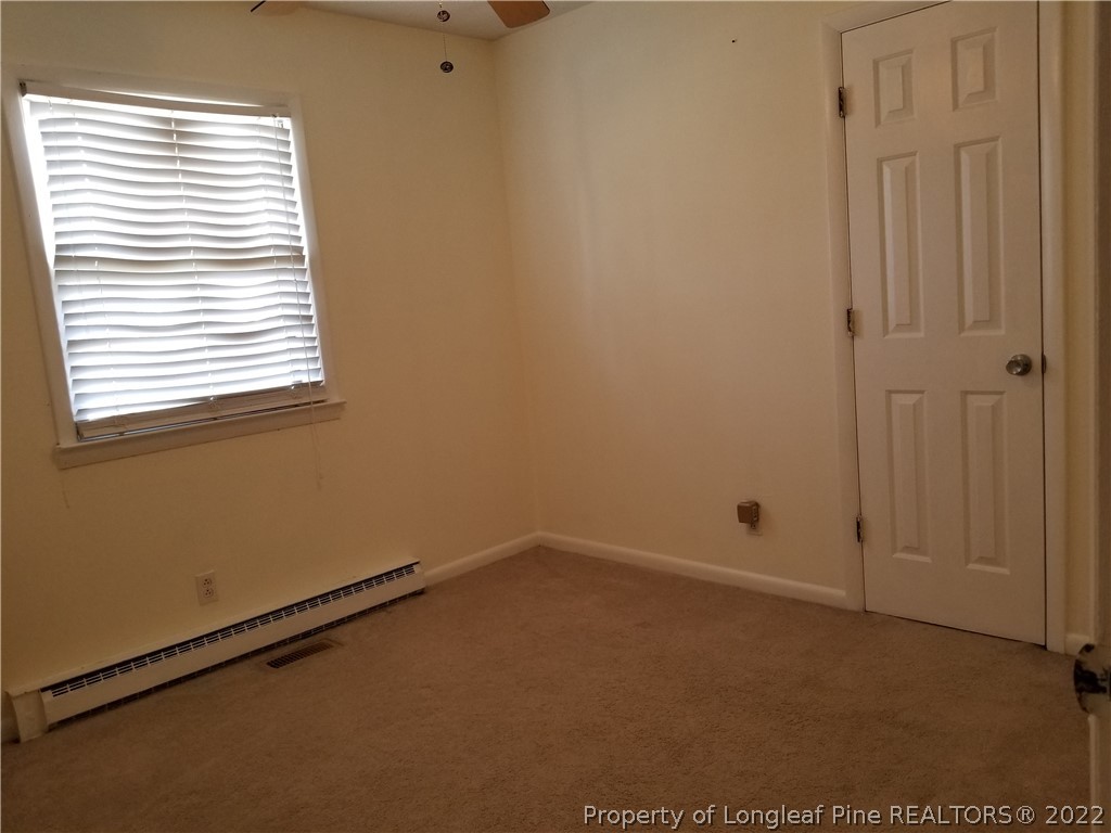 3227 Legion Road Hope Mills, NC 28348 - Photo 5 of 10 an empty room with a window