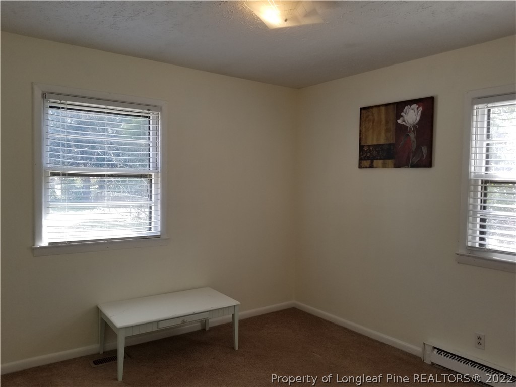 3227 Legion Road Hope Mills, NC 28348 - Photo 6 of 10 a room with a window and a chair