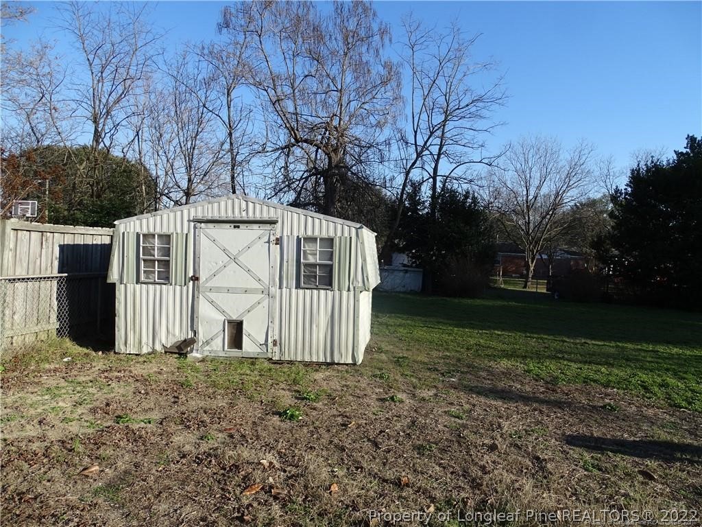 3227 Legion Road Hope Mills, NC 28348 - Photo 10 of 10 a view of a house with a yard