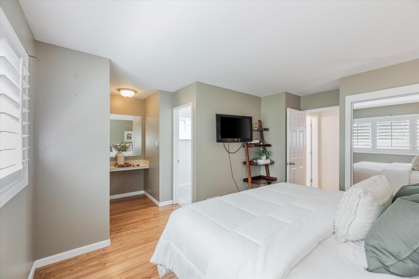 145 Lassen Drive San Bruno, CA 94066 - Photo 13 of 29 a bedroom with a bed and a flat screen tv