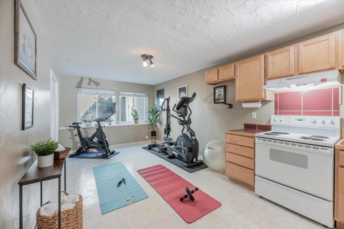 145 Lassen Drive San Bruno, CA 94066 - Photo 16 of 29 a room with gym equipment and wooden floor