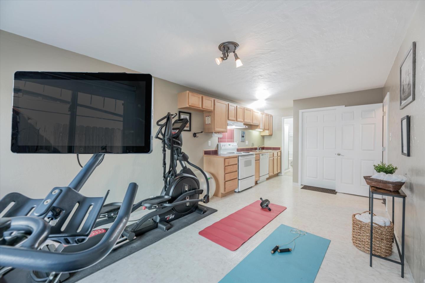 145 Lassen Drive San Bruno, CA 94066 - Photo 17 of 29 a view of a room with gym equipment