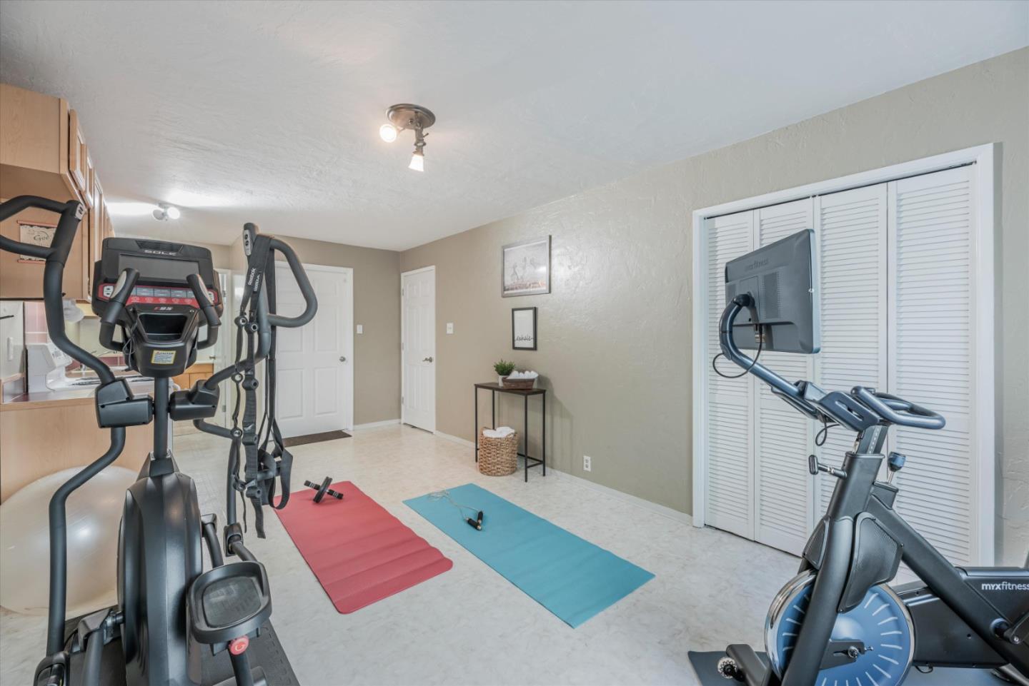 145 Lassen Drive San Bruno, CA 94066 - Photo 18 of 29 a view of a room with gym equipment