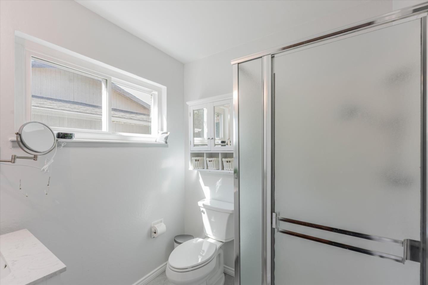 145 Lassen Drive San Bruno, CA 94066 - Photo 20 of 29 a white toilet sitting next to a bathroom sink
