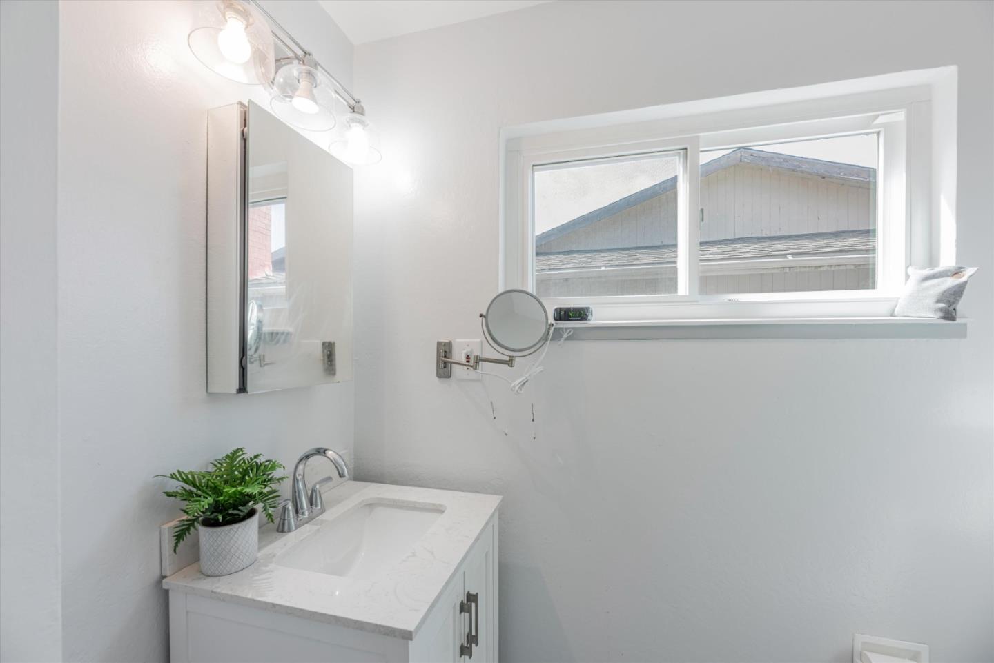 145 Lassen Drive San Bruno, CA 94066 - Photo 21 of 29 a bathroom with a sink and mirror