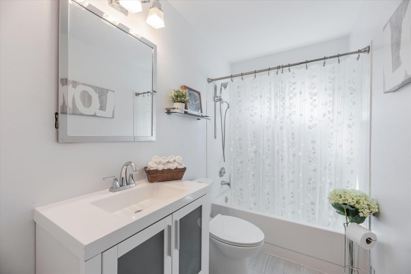 145 Lassen Drive San Bruno, CA 94066 - Photo 22 of 29 a bathroom with a sink toilet and shower