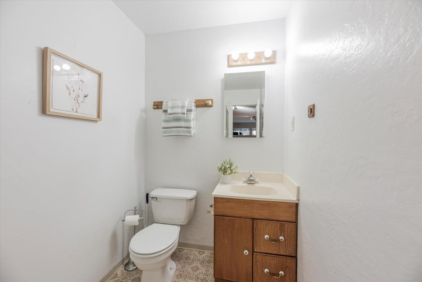 145 Lassen Drive San Bruno, CA 94066 - Photo 23 of 29 a bathroom with a toilet sink and mirror