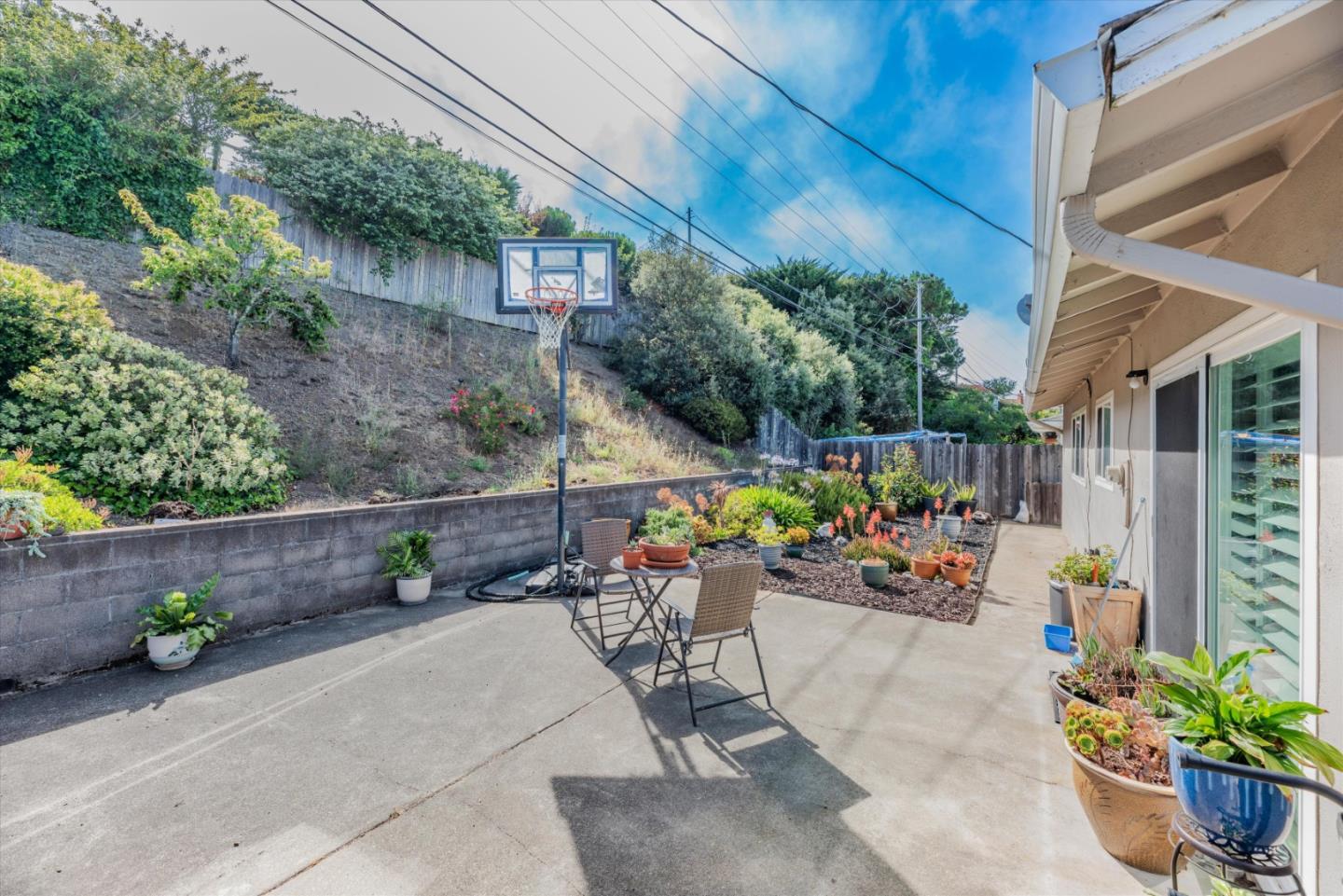 145 Lassen Drive San Bruno, CA 94066 - Photo 24 of 29 a view of a chairs and table in a backyard