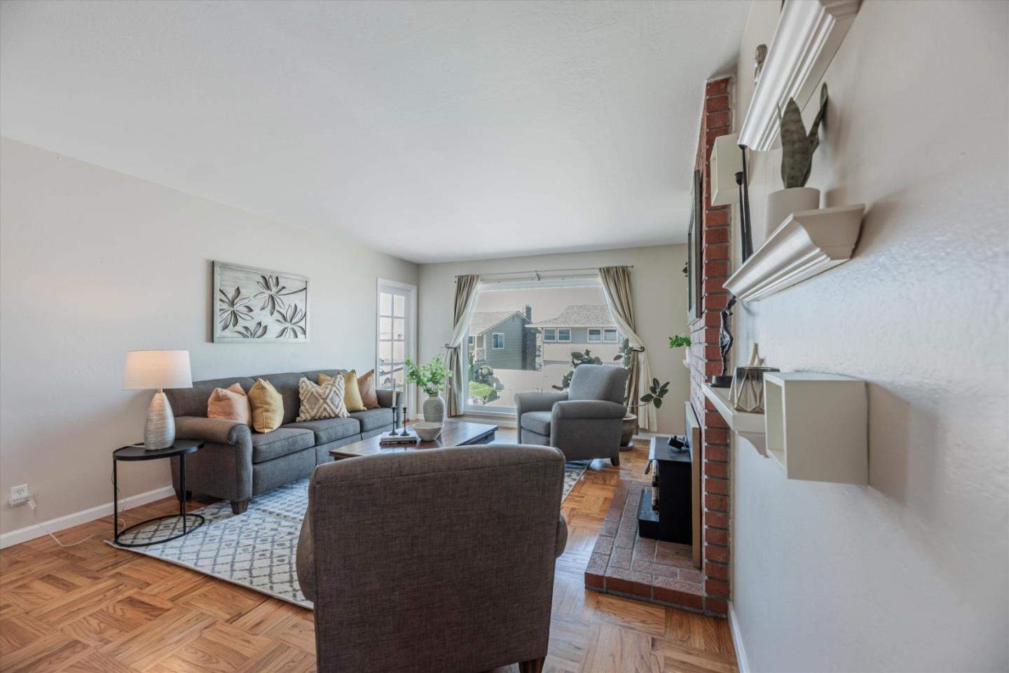145 Lassen Drive San Bruno, CA 94066 - Photo 3 of 29 a living room with furniture and a chandelier
