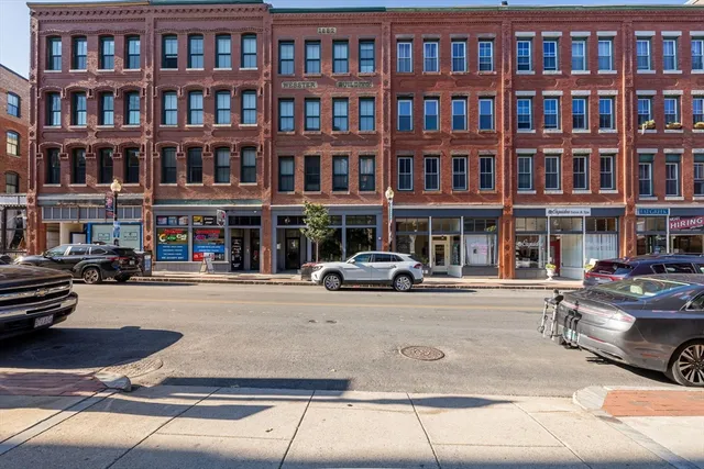 a view of an buildings with cars