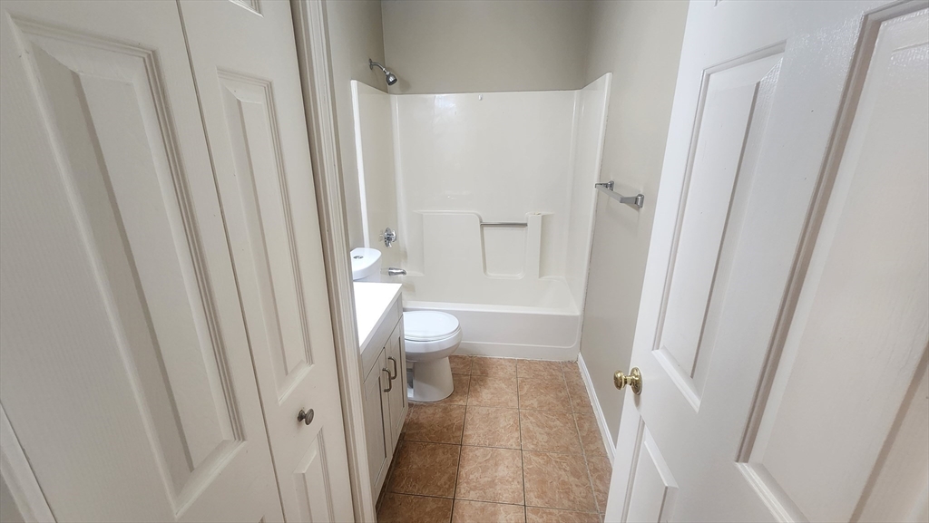 19 Washington Street, Unit 5 Haverhill, MA 01832 - Photo 4 of 17 a bathroom with a sink and toilet