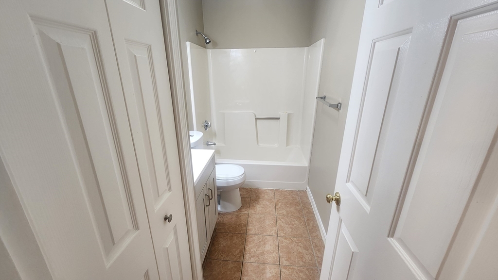 19 Washington Street, Unit 5 Haverhill, MA 01832 - Photo 5 of 17 a bathroom with a sink and a toilet