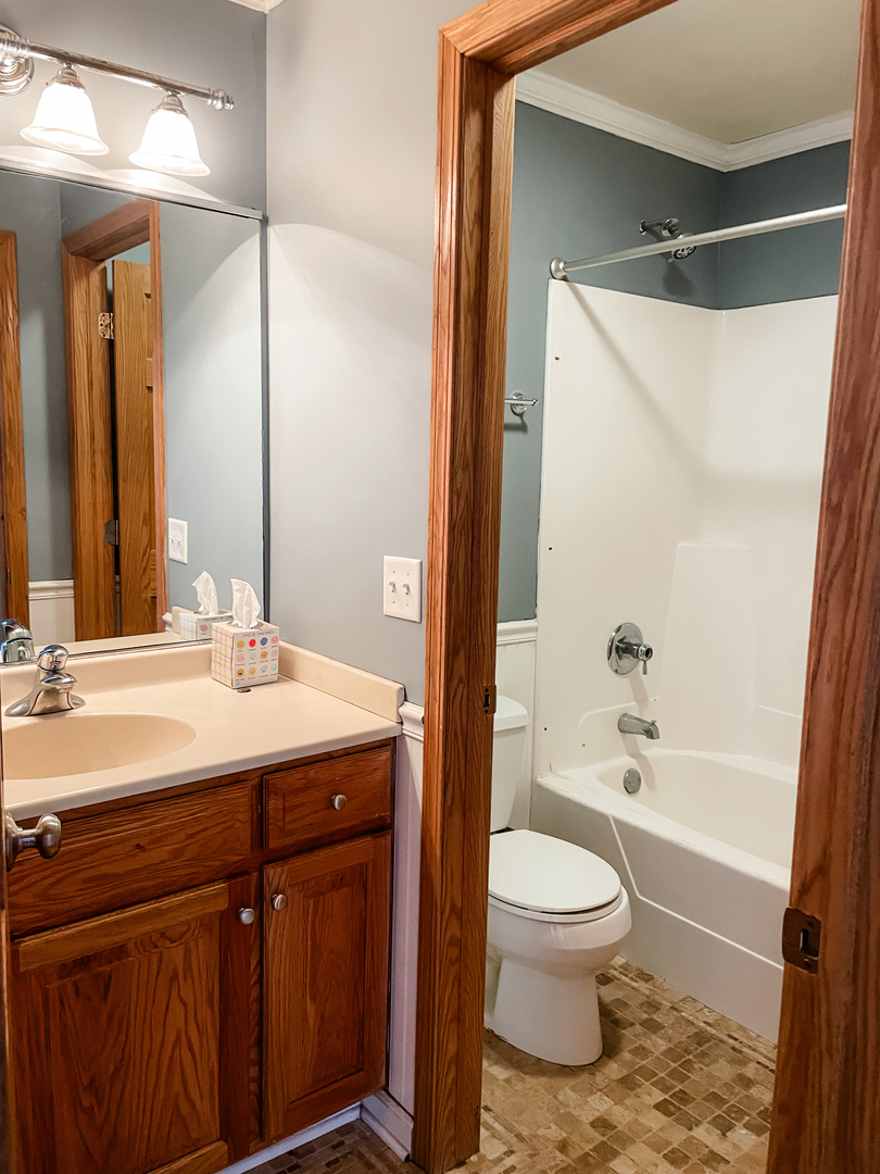 1308 Axcel Lane Sycamore, IL 60178 - Photo 17 of 40 a bathroom with a granite countertop sink toilet and shower