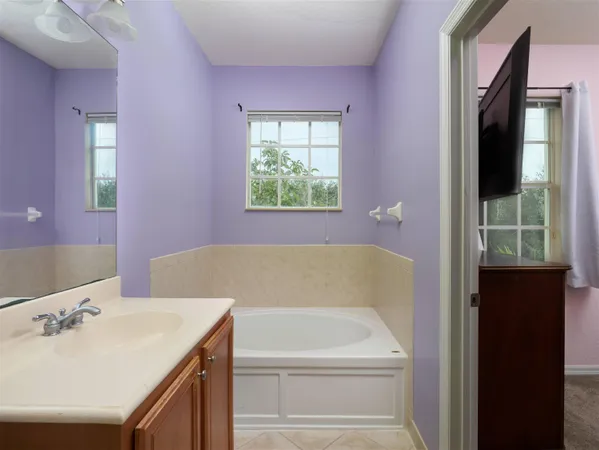 a bathroom with a bathtub and a sink