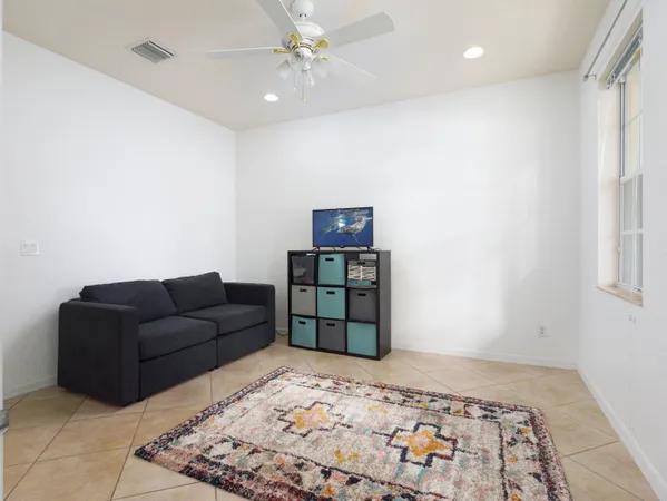 a living room with a couch and a rug