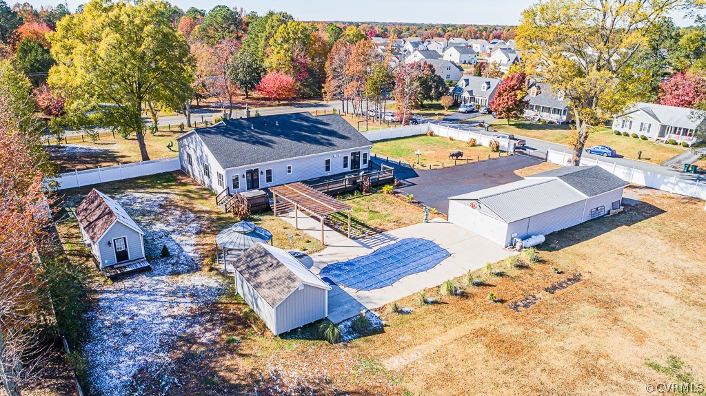 a view of a backyard with chairs