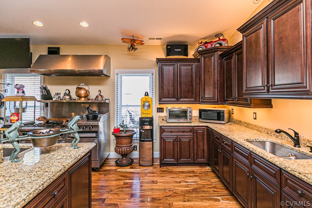 1982 Mountain Road Glen Allen, VA 23060 - Photo 20 of 49 a kitchen with stainless steel appliances granite countertop a sink stove and cabinets
