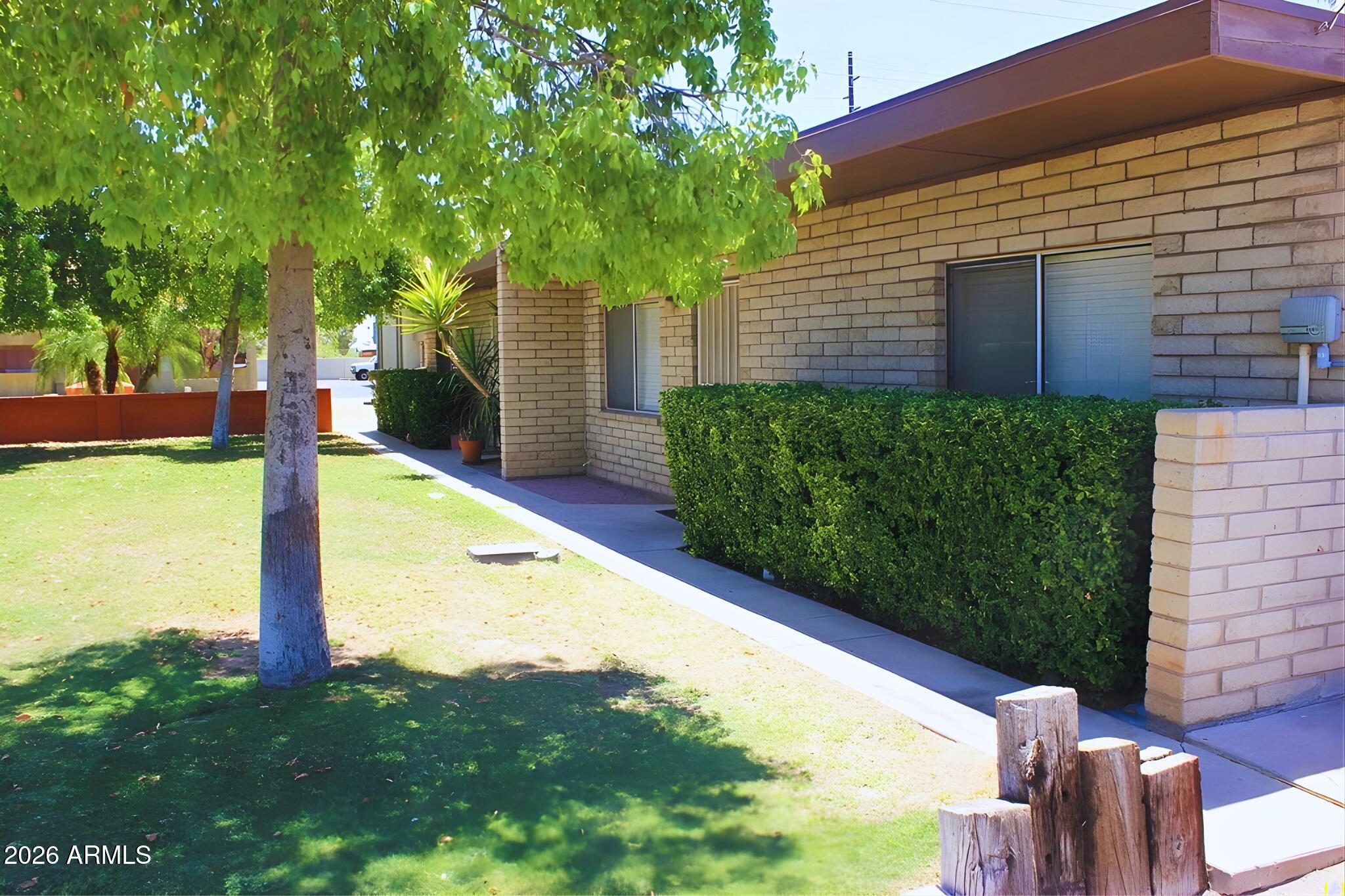 1326 North Miller Road, Unit A Tempe, AZ 85288 - Photo 1 of 6 a view of a backyard with plants