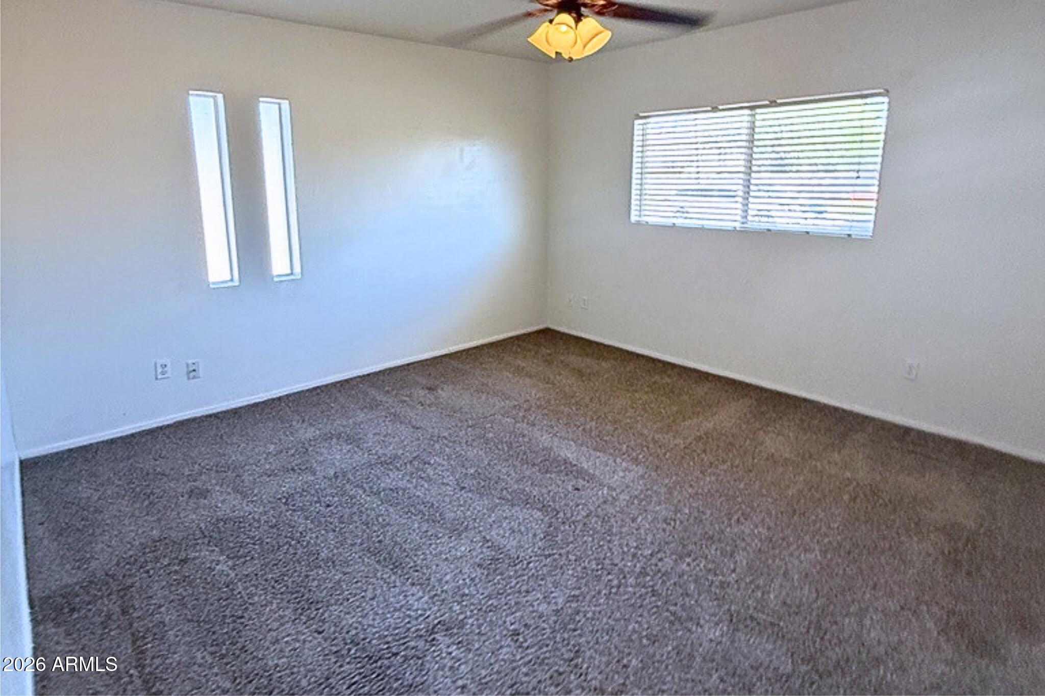 1326 North Miller Road, Unit A Tempe, AZ 85288 - Photo 4 of 6 an empty room with a window