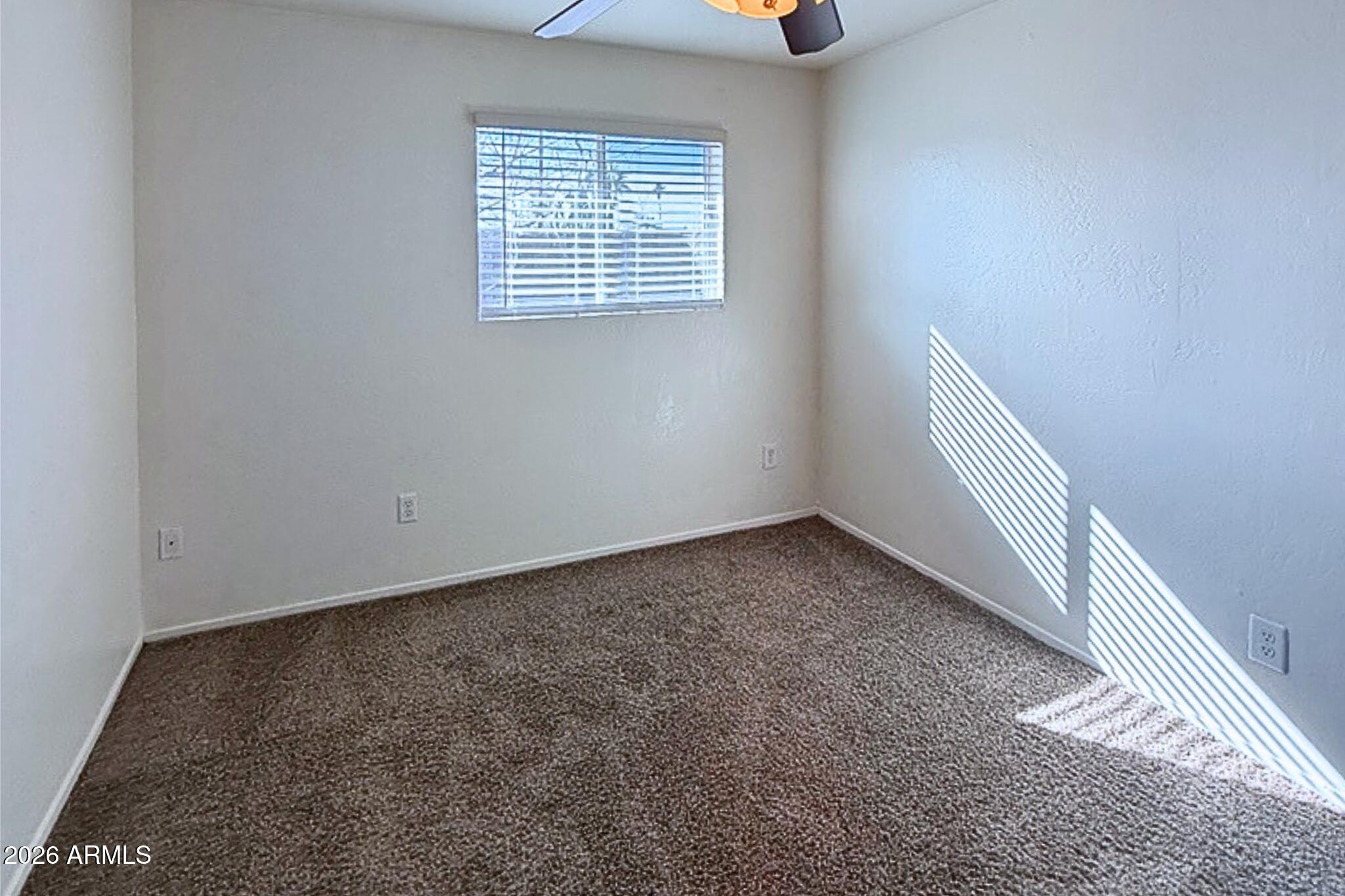 1326 North Miller Road, Unit A Tempe, AZ 85288 - Photo 6 of 6 an empty room with a window