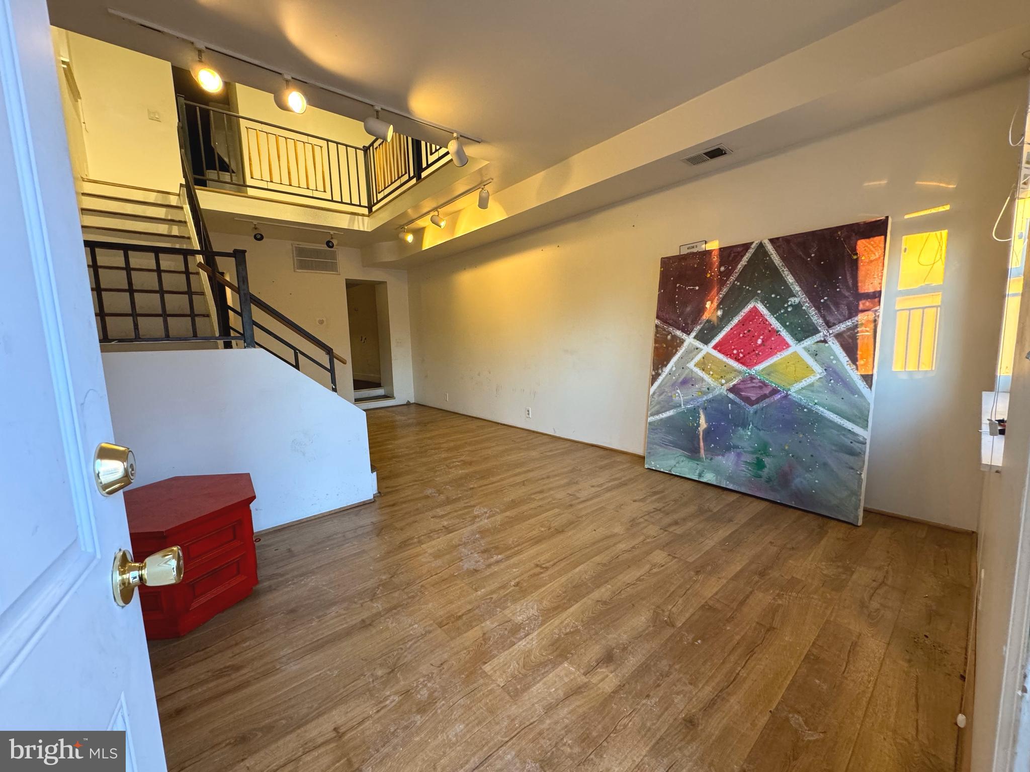 918 Ramsay Street Baltimore, MD 21223 - Photo 5 of 19 a view of entryway and hall with wooden floor