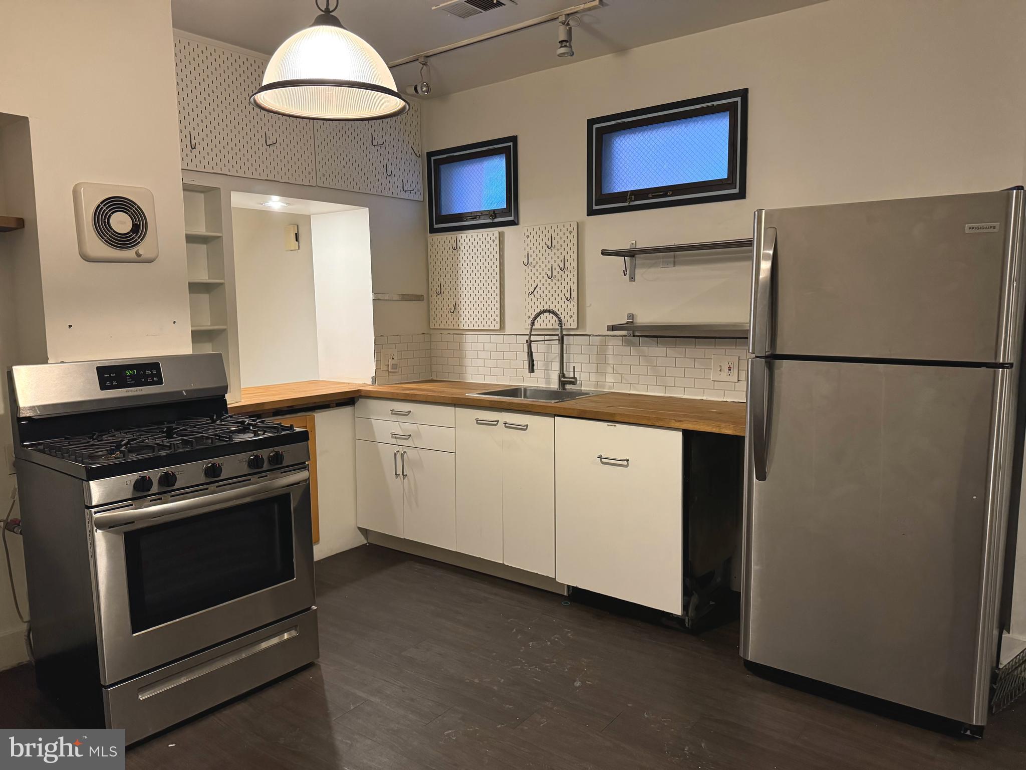 918 Ramsay Street Baltimore, MD 21223 - Photo 8 of 19 a kitchen with a stove and a refrigerator