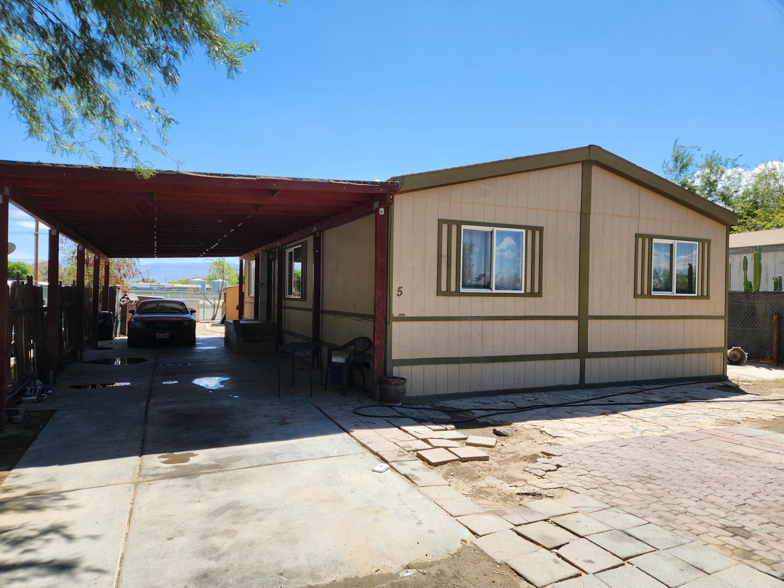 79550 Ave 40, Unit 5 Indio, CA 92203 - Photo 1 of 6 a front view of a house