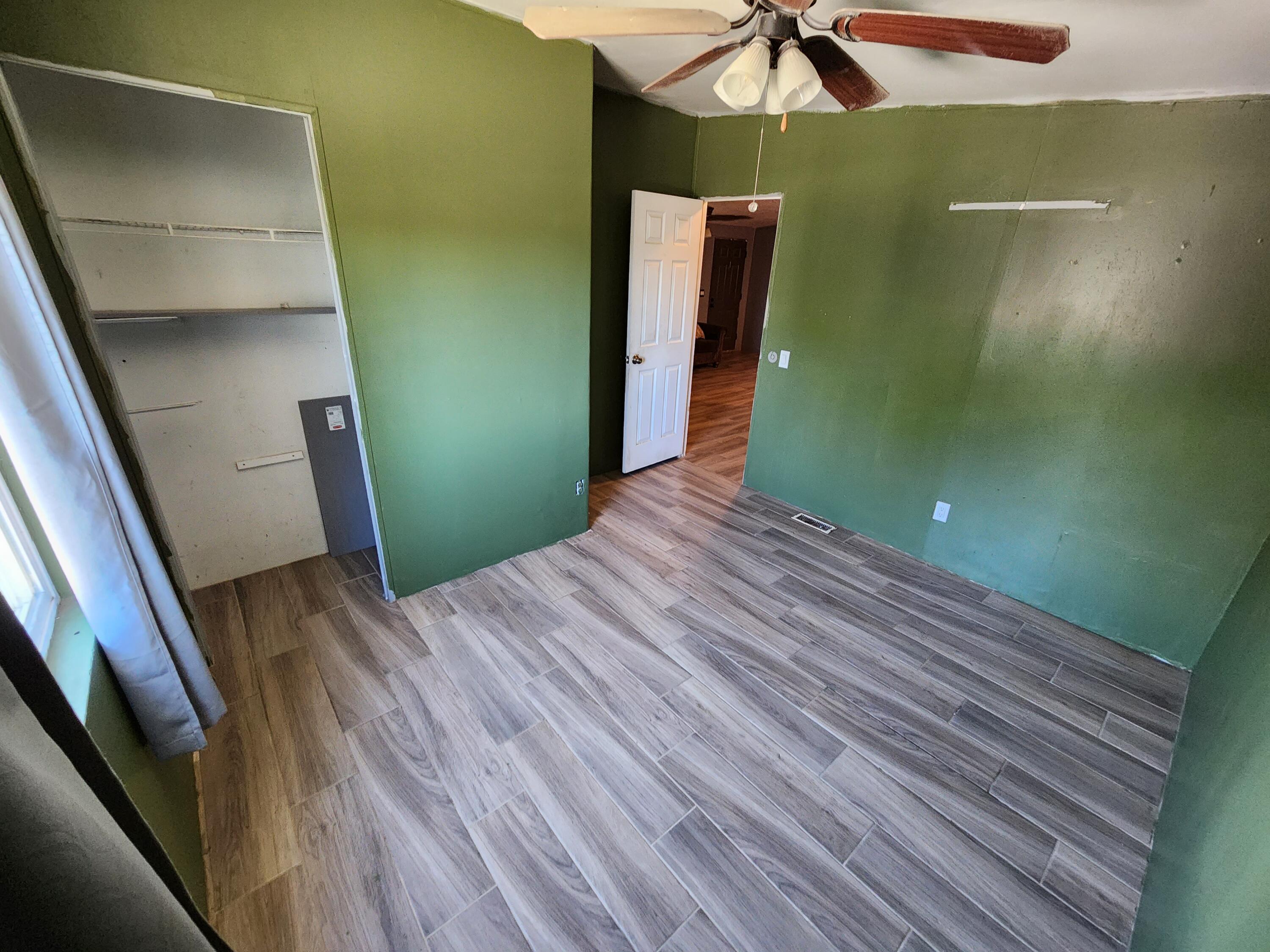 79550 Ave 40, Unit 5 Indio, CA 92203 - Photo 3 of 6 a view of a room with wooden floor